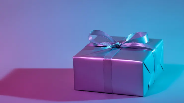 Gift box illuminated with colorful lights
