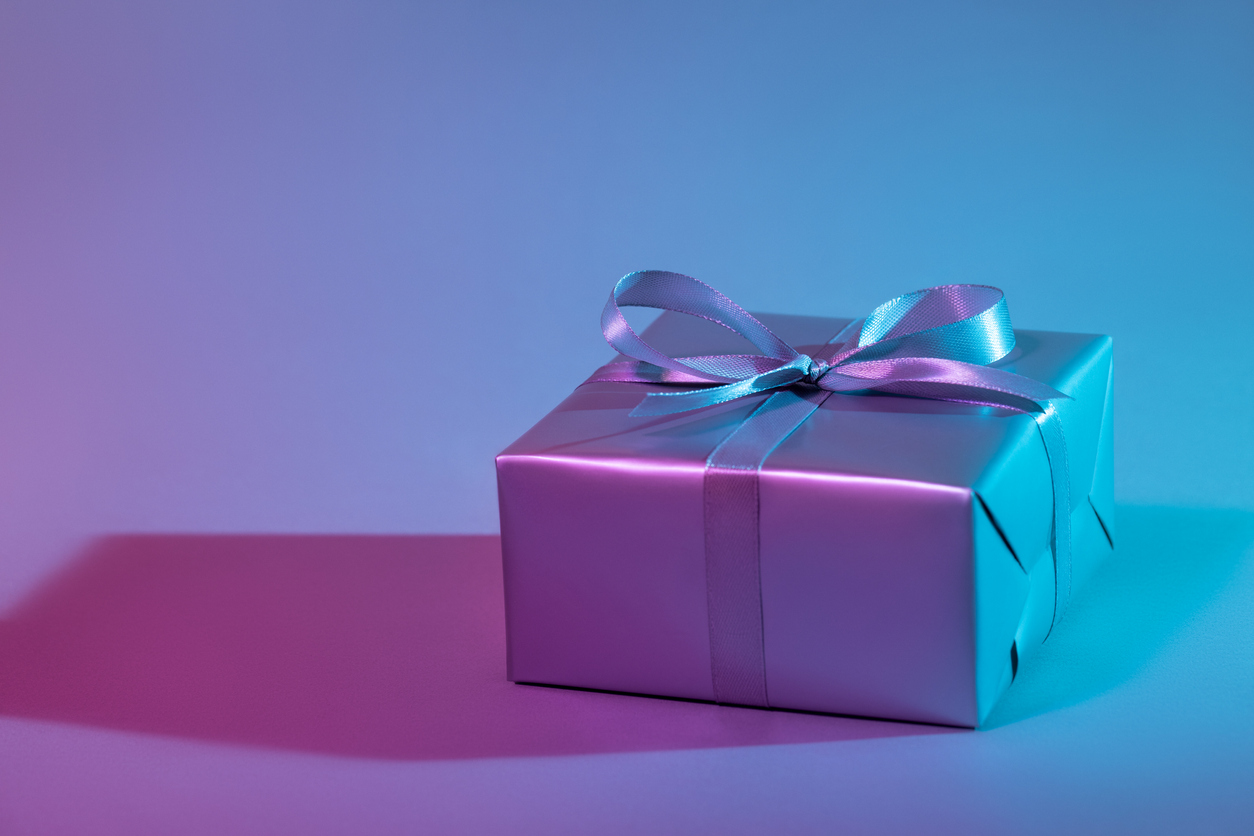 Gift box illuminated with colorful lights